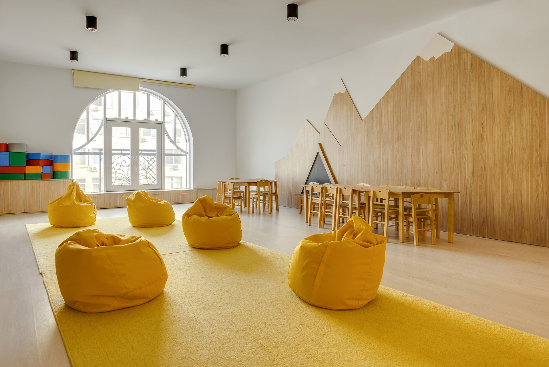 yellow-bean-bag-chairs-and-wooden-tables-in-kinder-2022-02-01-22-39-38-utc